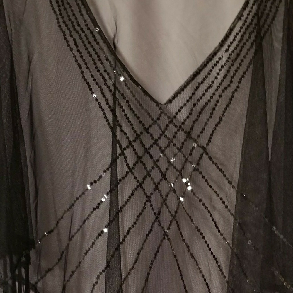 Sheer poncho with fringe